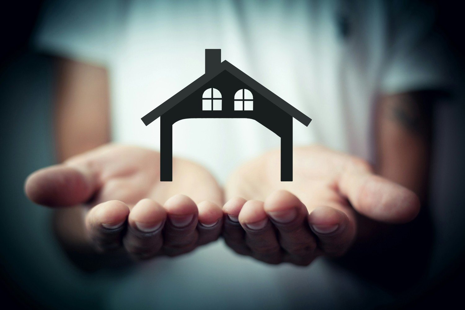 Hands Holding House