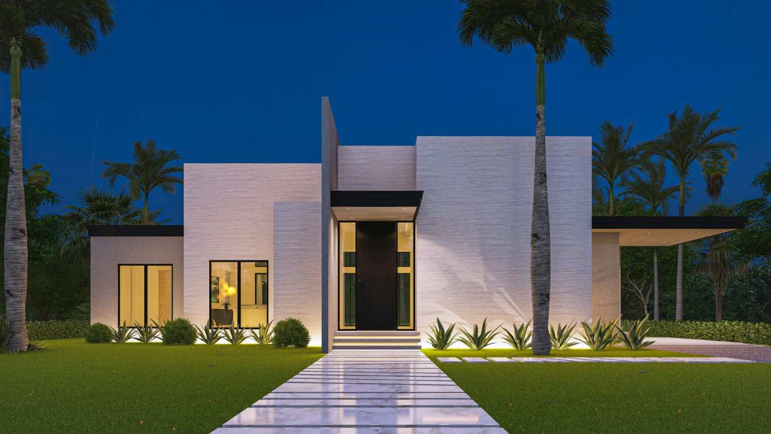 Modern limestone residence lit at night with palms and a stone walk